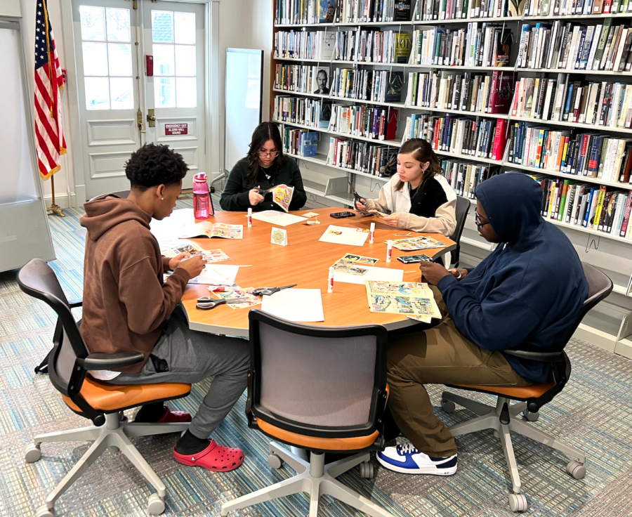 Library collage workshop participants creating art together.